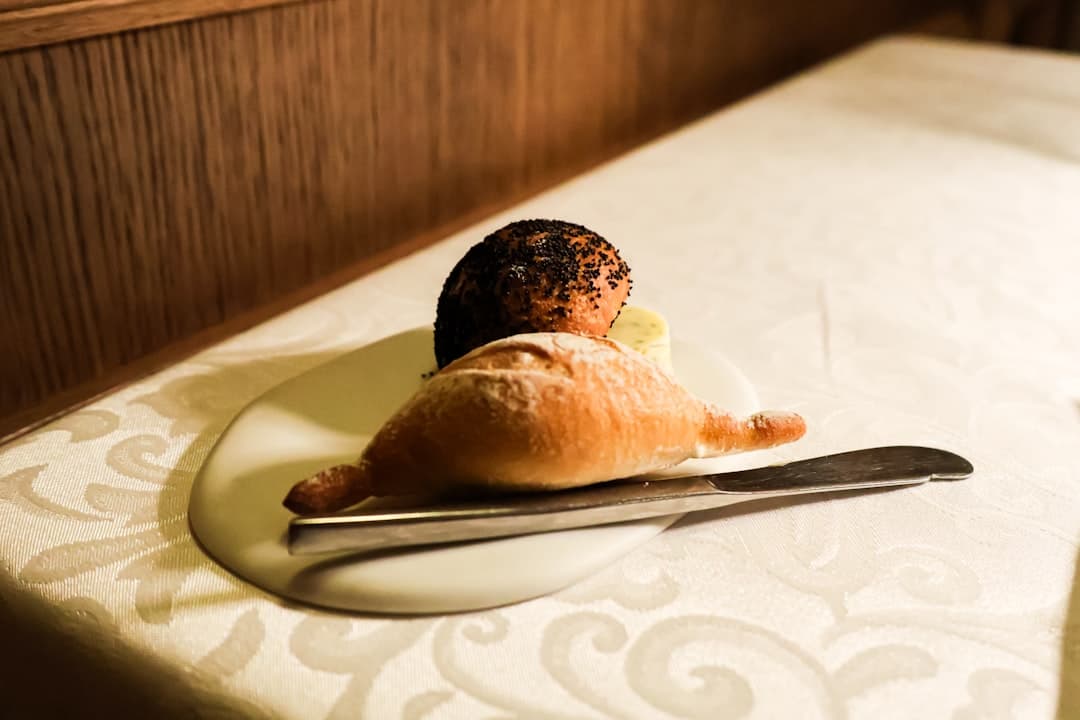 A piece of bread sitting on top of a white plate
