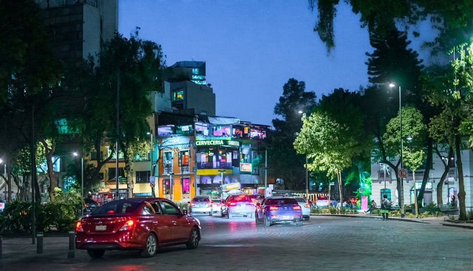 Vibrant night scene with traffic in Ciudad de México, CDMX, capturing urban life.