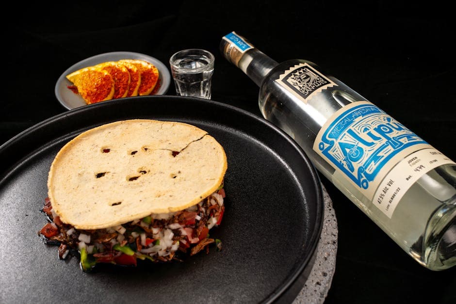 Delight in authentic Mexican flavors with mezcal and tacos served elegantly.