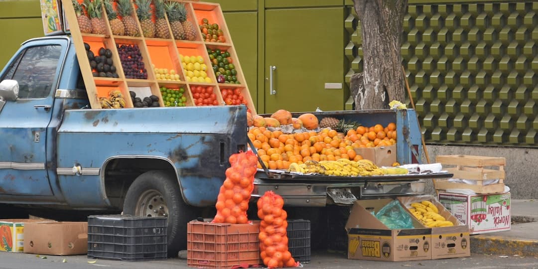orange fruits on brown wooden crate