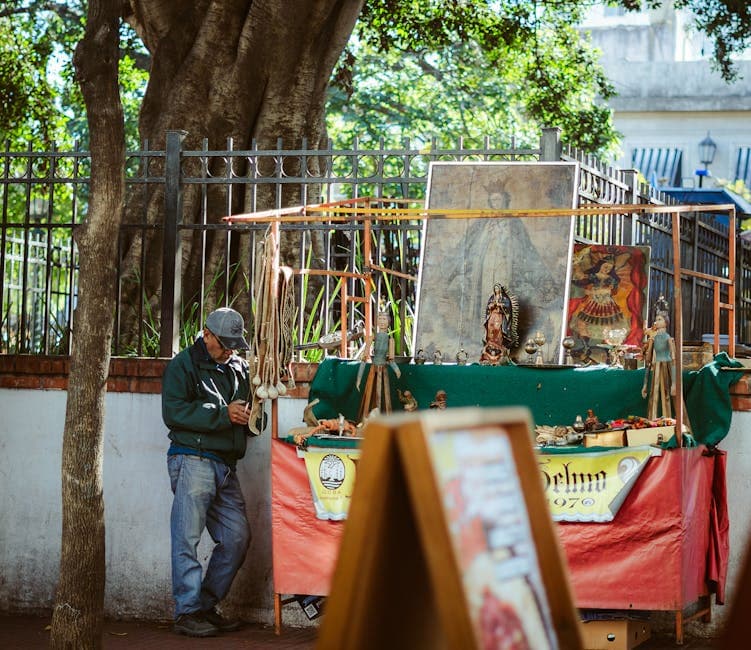 A local vendor sells religious items at an outdoor market in Buenos Aires, Argentina.