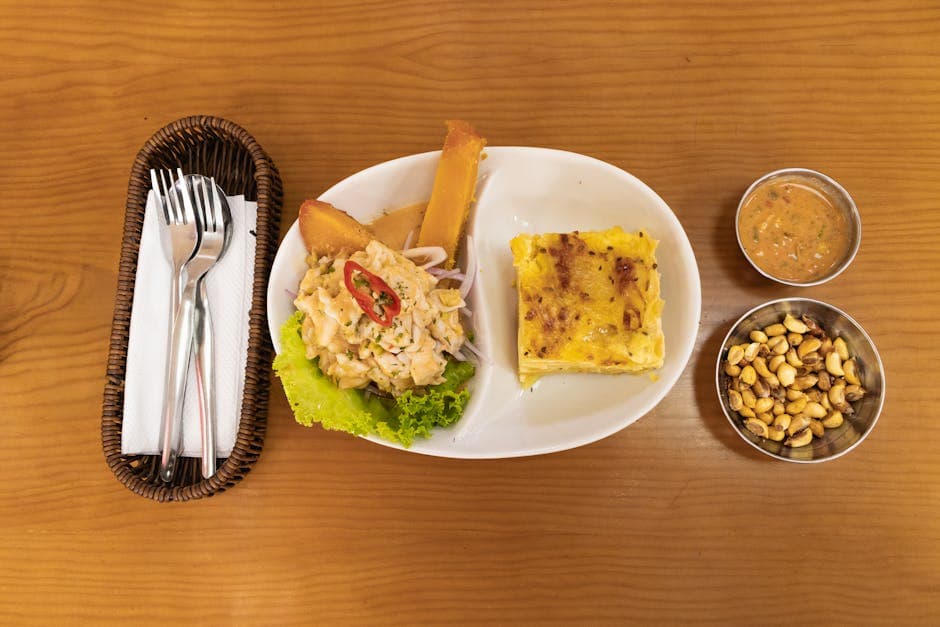 Delicious traditional Peruvian meal with ceviche and potato pie served at a local restaurant in Arequipa.