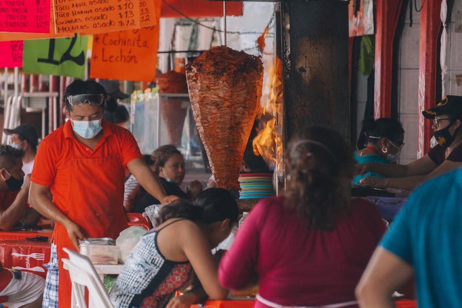 Street market in Mérida showcasing shawarma and local vendors.
