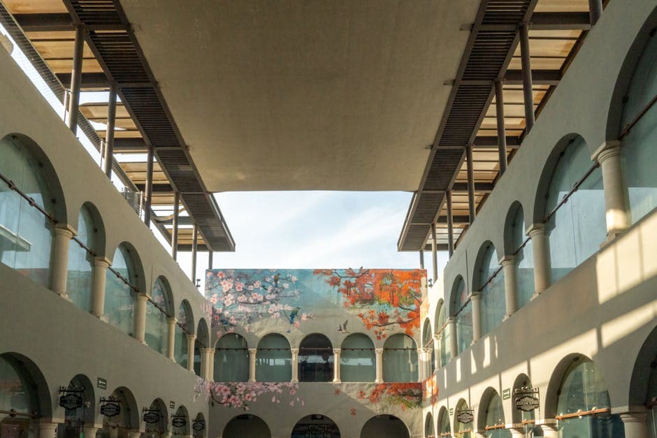 Explore the vibrant arched passage with murals in Mérida's Pasaje Picheta.