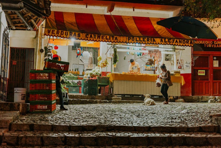 Vibrant night market scene with street vendor, shoppers, and a relaxed dog.