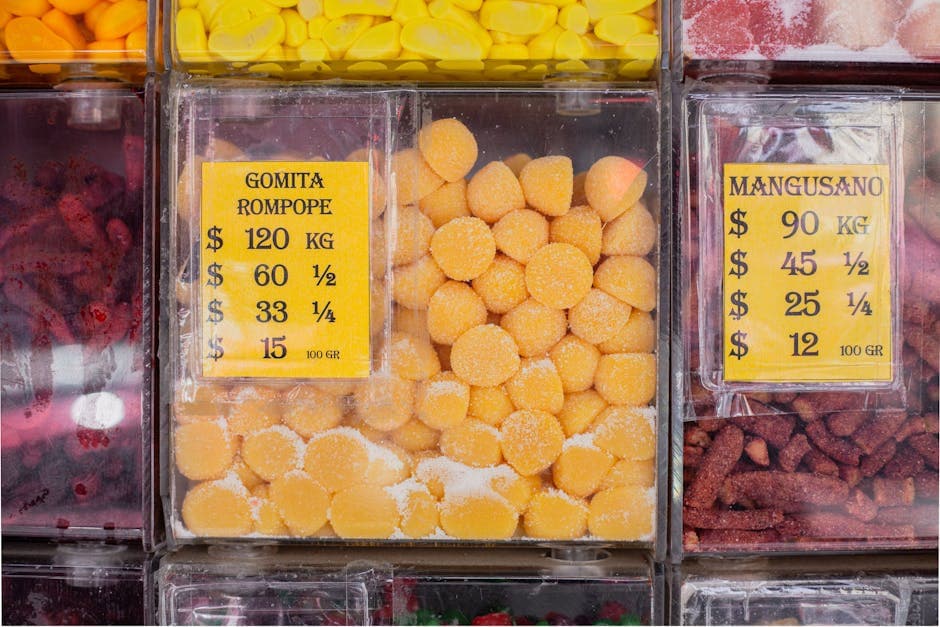 A vibrant display of assorted candies including gomita rompope in Ciudad de México market.