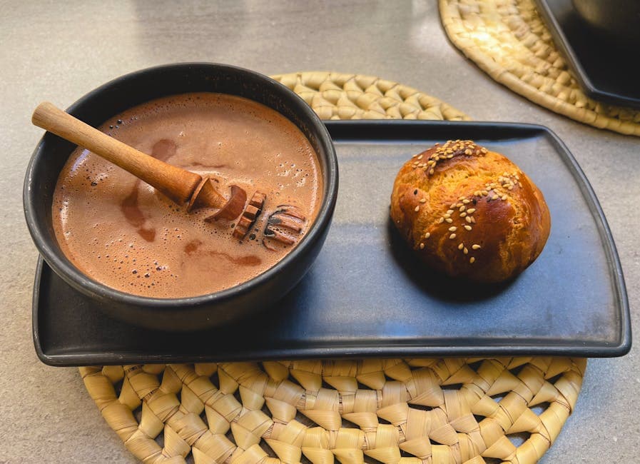 Delicious Mexican hot chocolate served with artisan Pan de Yema in Oaxaca de Juárez.