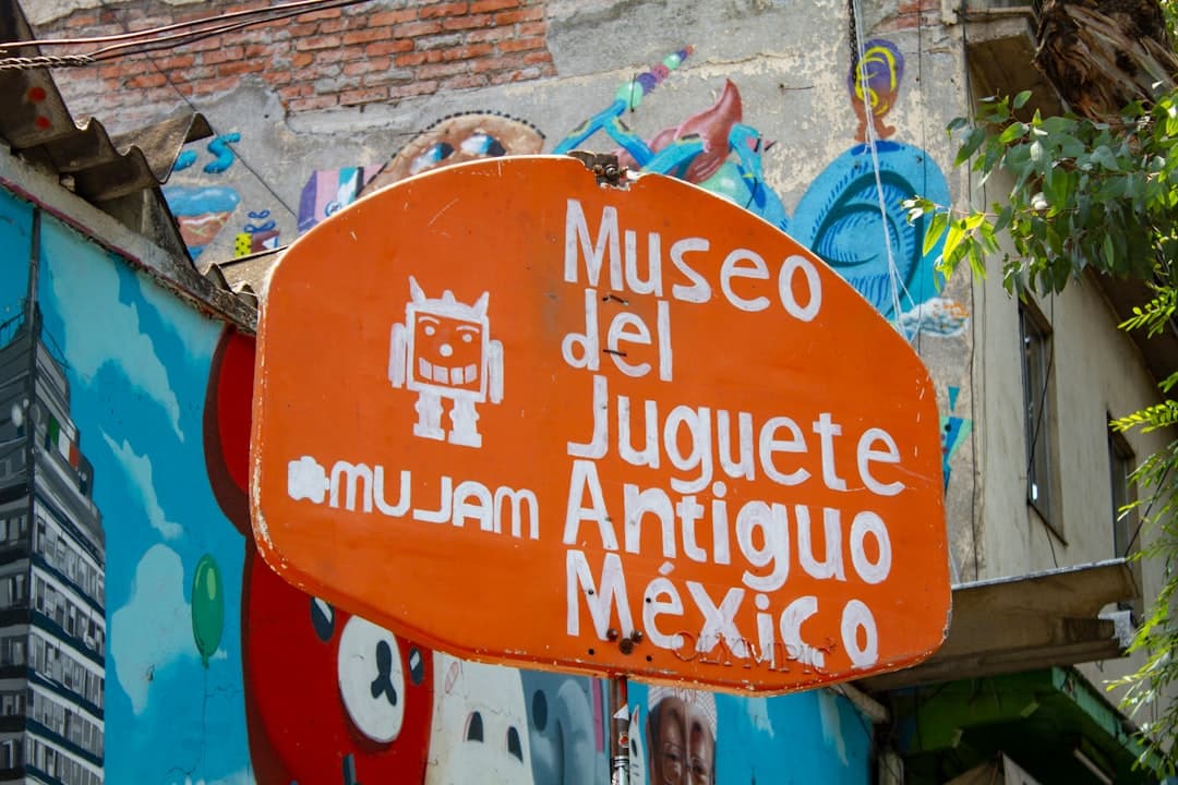 orange and white Museo del Juguete Antiguo Mexico signage