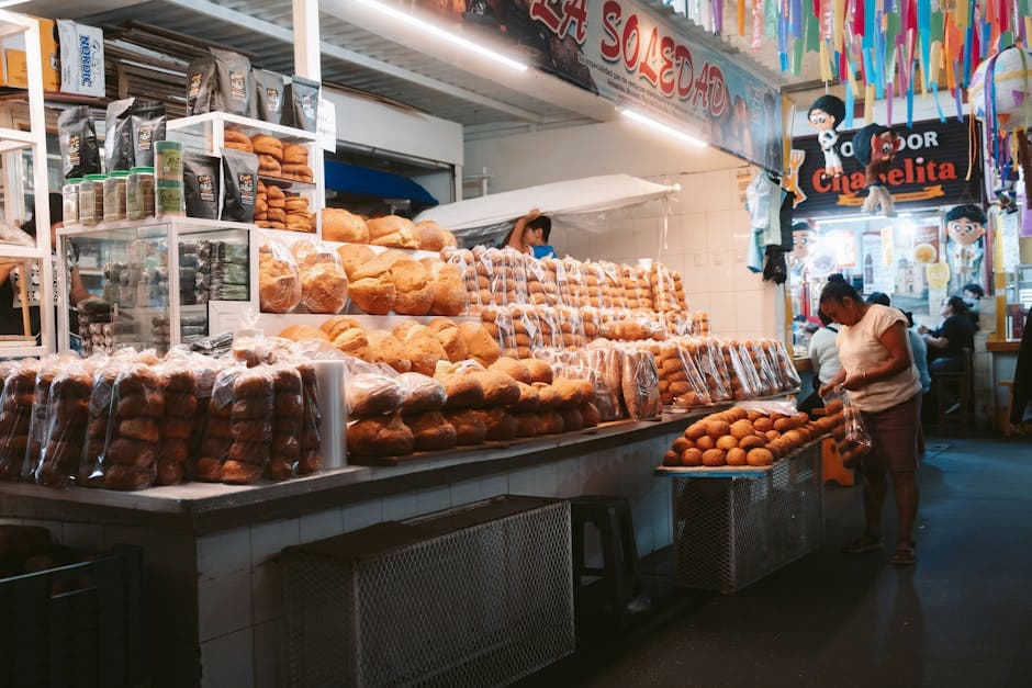Explore the bustling bread market in Oaxaca de Juárez, filled with diverse baked goods and local culture.