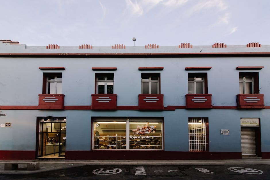 Colorful traditional building on a quiet street in Oaxaca, Mexico.
