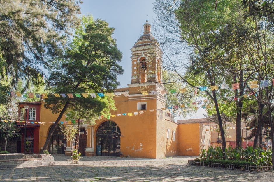 Charming view of the Chapel of Santa Catarina in Mexico City surrounded by greenery.