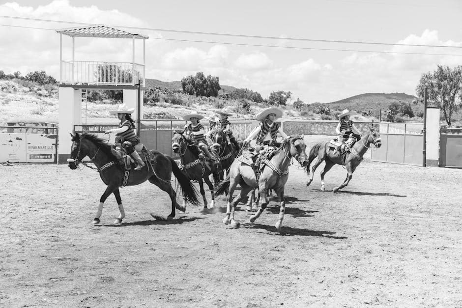 Mexican charros riding horses in a traditional rodeo at San Juan Tizahuapan, Hidalgo.