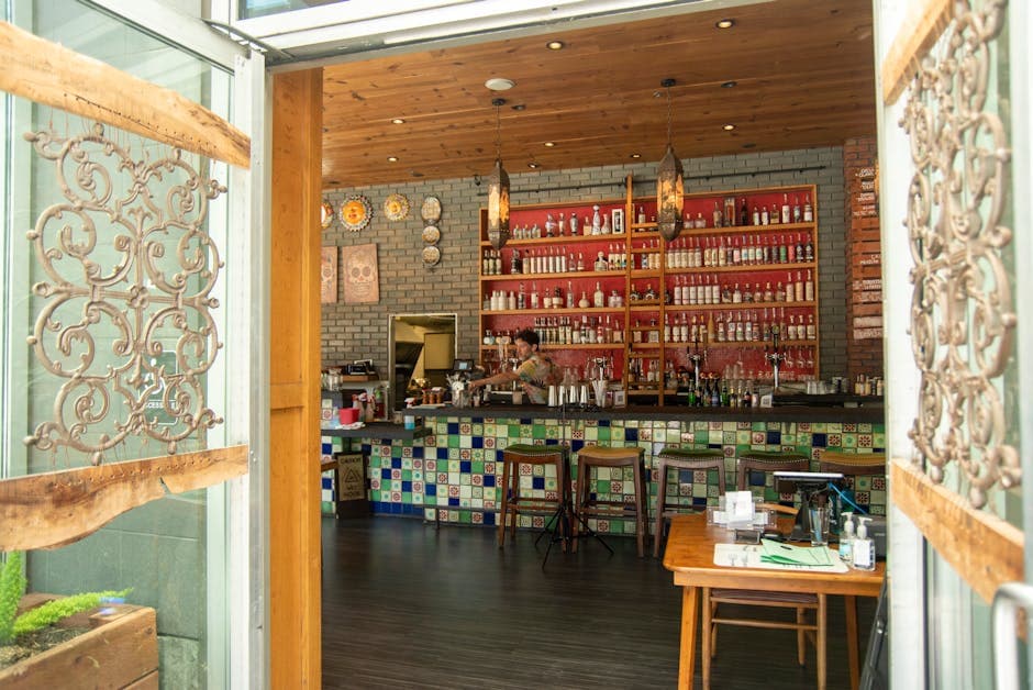 Charming Mexican-themed bar in San Francisco with vibrant tiles and bottles.