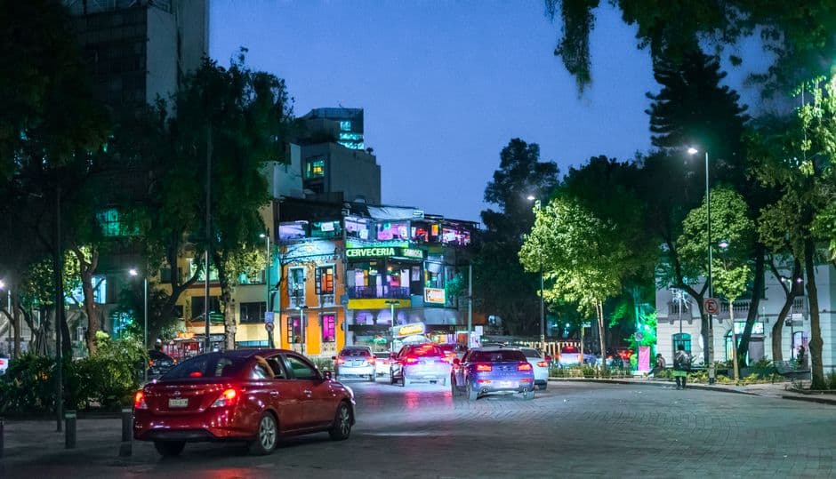 Vibrant night scene with traffic in Ciudad de México, CDMX, capturing urban life.