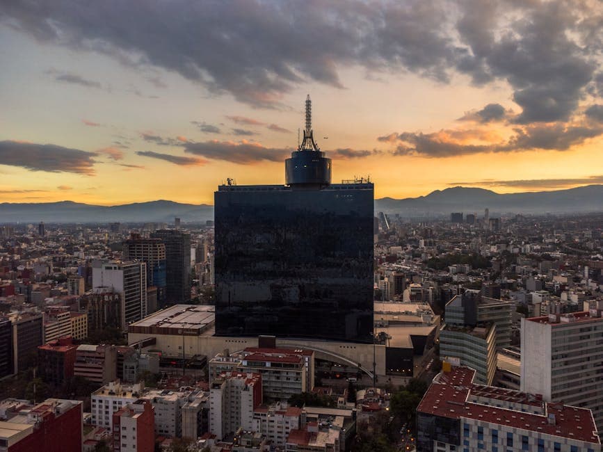 Aerial view of Ciudad de México showcasing the cityscape during a vibrant sunset.