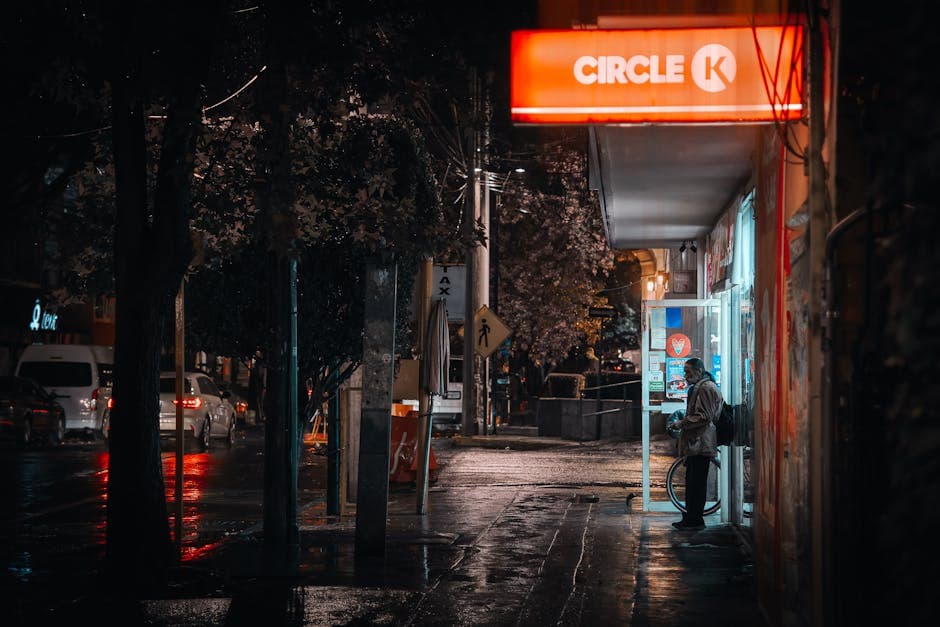 Captivating nighttime view of a Circle K sign illuminating a street in Mexico City.