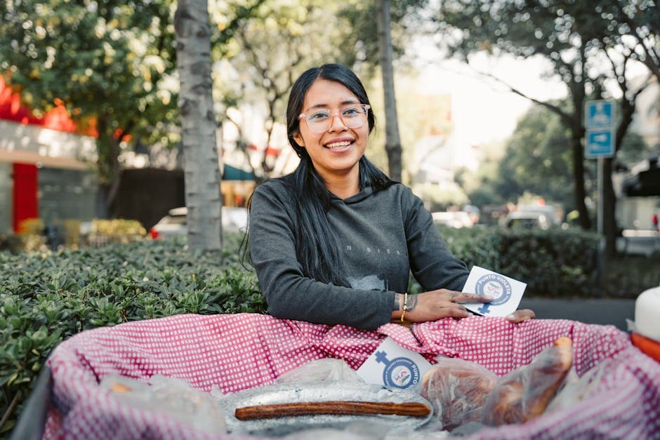 A smiling woman selling churros outdoors in Mexico City, showcasing local street food culture.