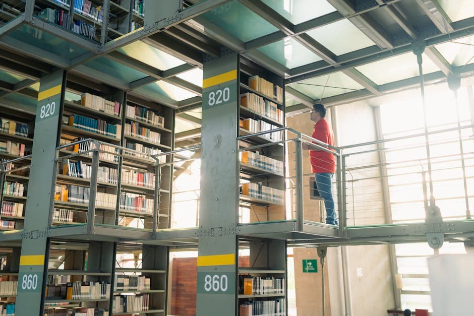 Student browsing bookshelves in a modern library in Mexico City