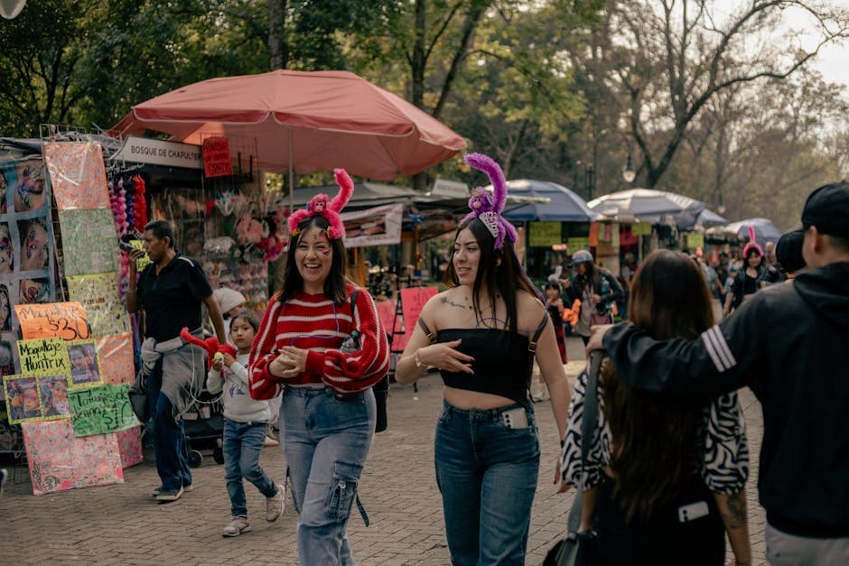 Visitors enjoy a lively street market at Bosque de Chapultepec, Mexico City, on a bright day.