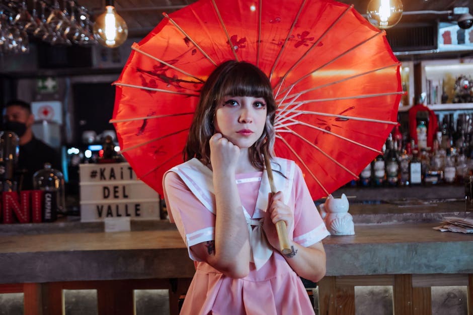 Young woman with a red parasol in a trendy bar in Ciudad de México. Showcases Japanese aesthetics and fashion.