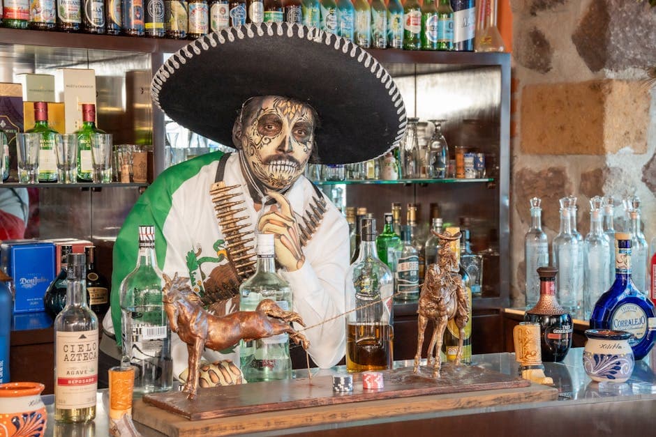 La Catrina themed bartender in traditional attire serving drinks at Mexican bar.