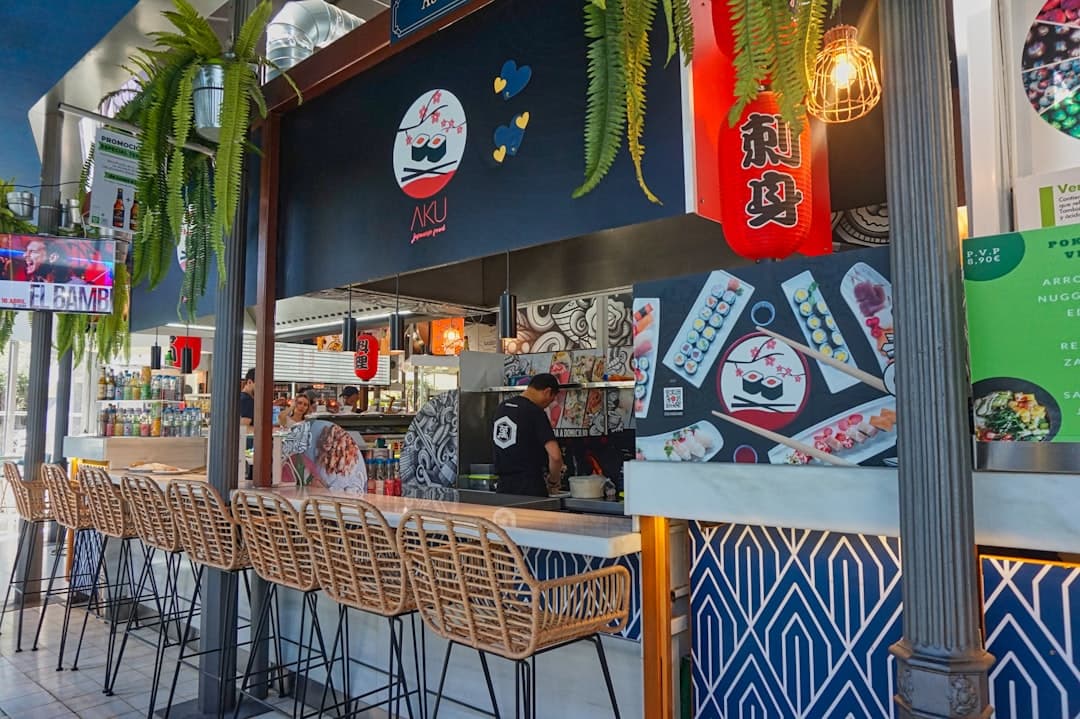 A restaurant that has a bunch of chairs in front of it
