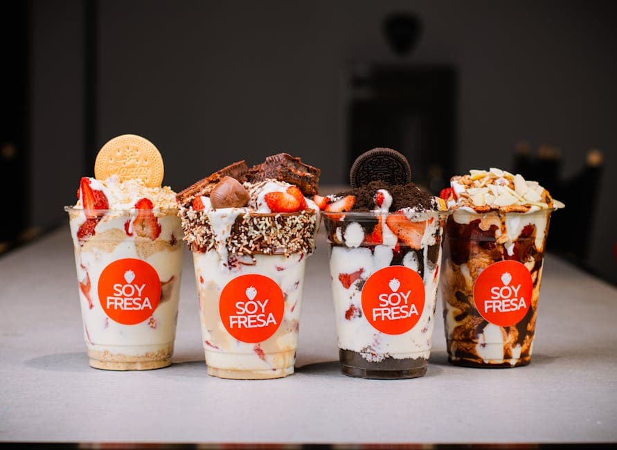 Savor a variety of delicious dessert cups from Soy Fresa, featuring fresh strawberries and toppings.