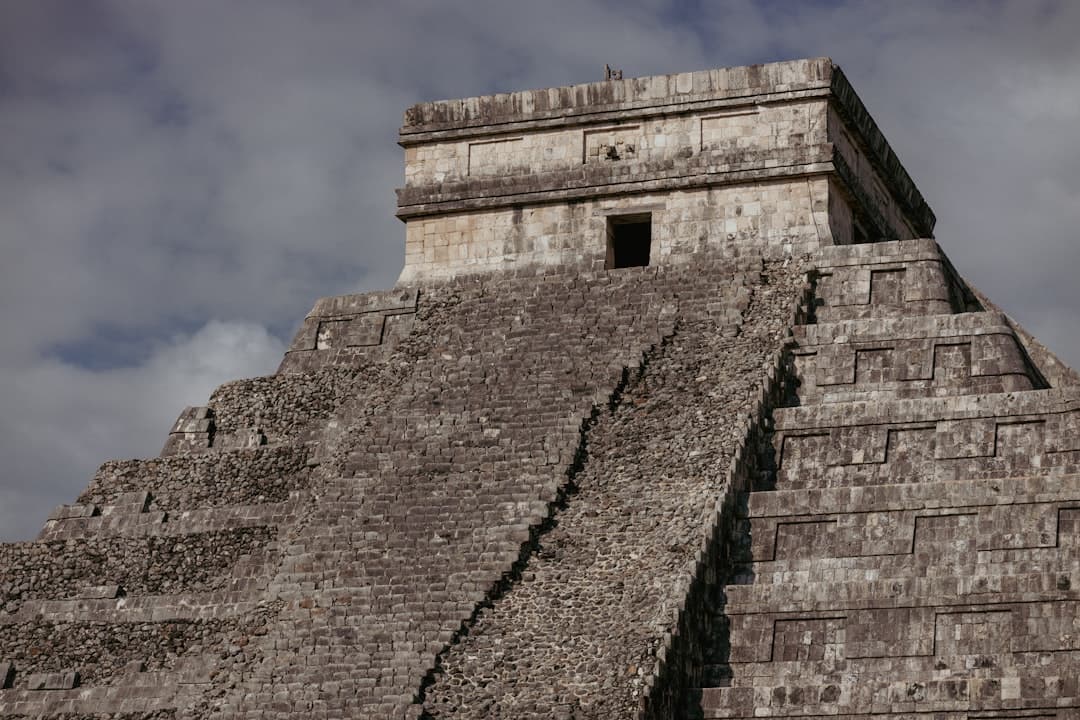 a very tall pyramid with a clock on top of it