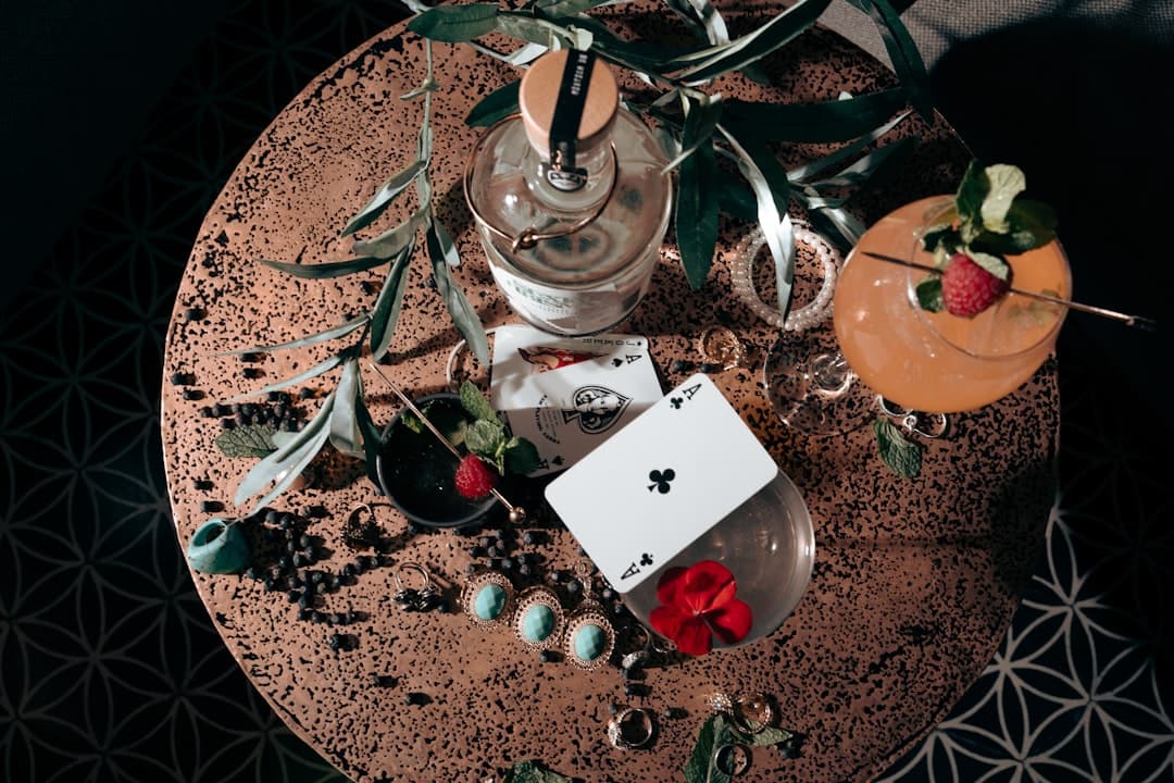a table topped with a card and a vase filled with flowers