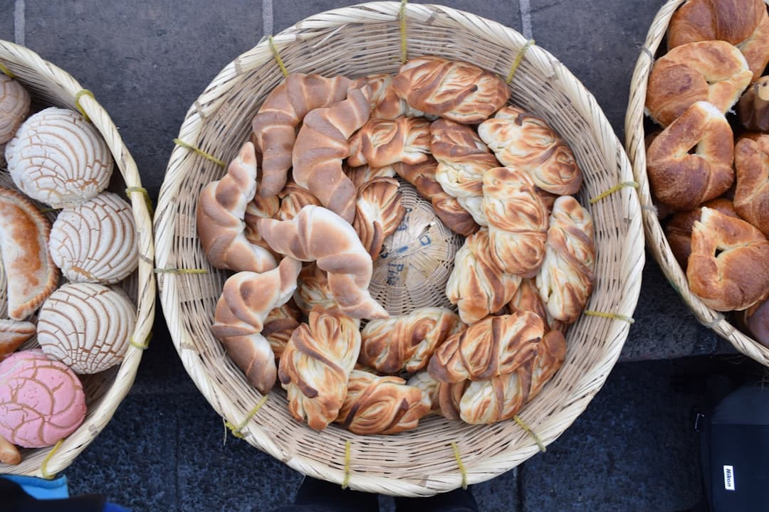 a couple of baskets filled with different types of bread