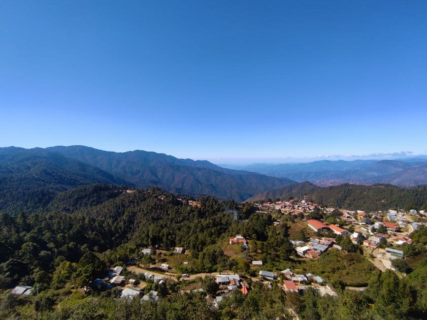 A breathtaking aerial view of San José del Pacífico, nestled in Oaxaca's mountainous landscape.