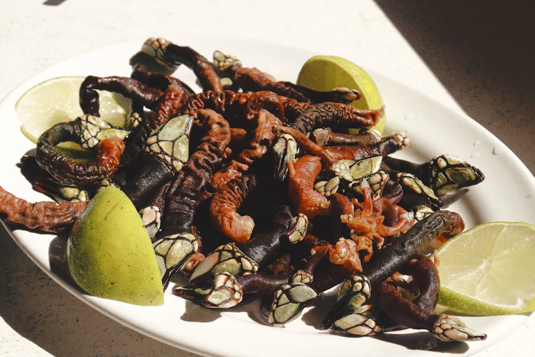 a white plate topped with fruit and nuts