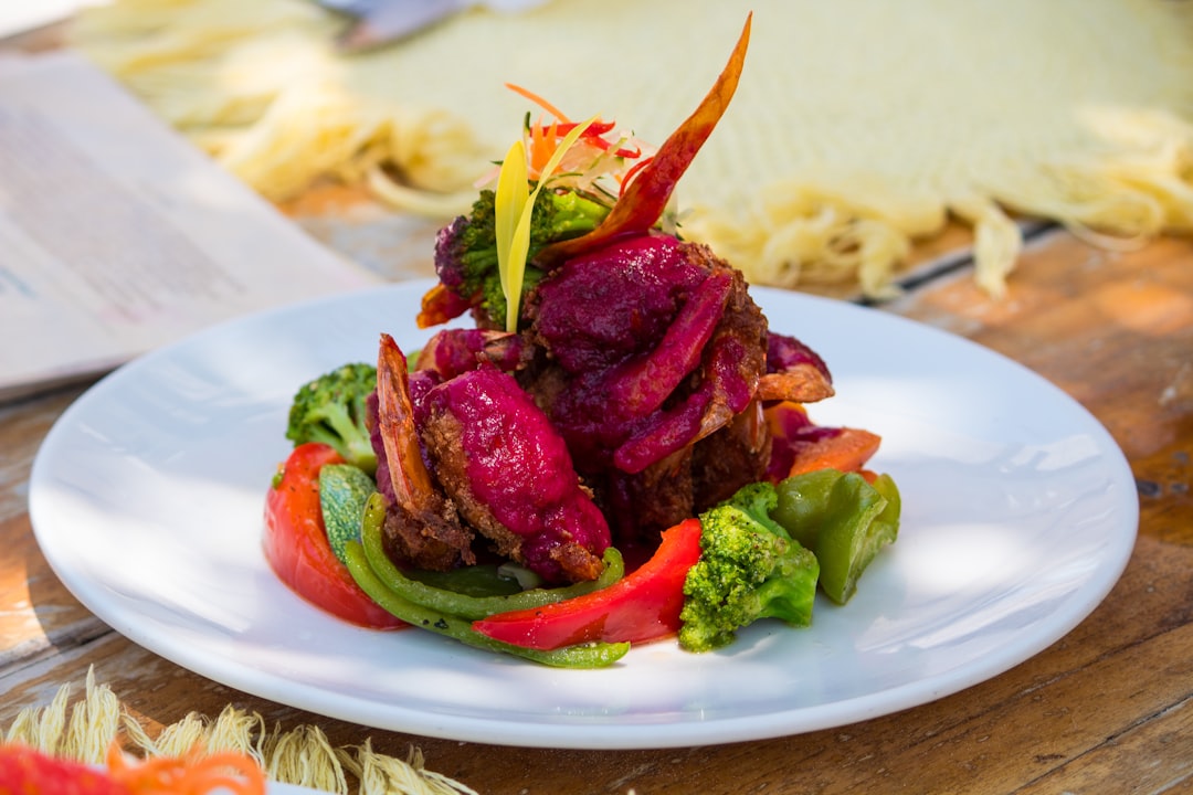 A white plate topped with lots of veggies