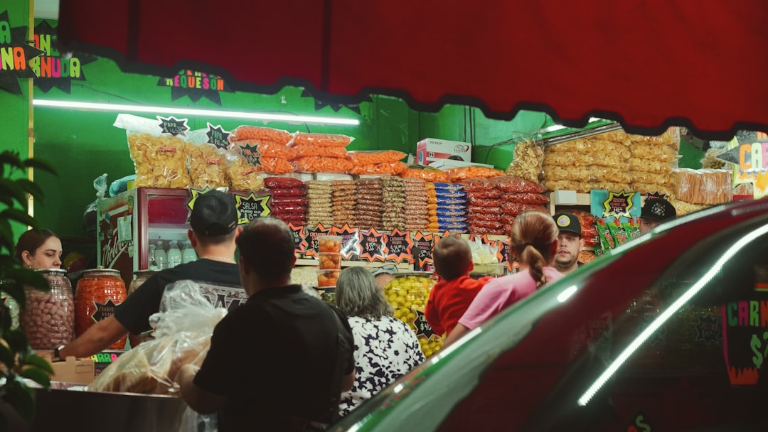 A group of people standing around a store