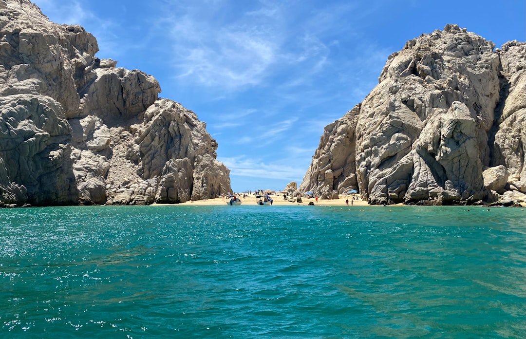 a body of water surrounded by large rocks