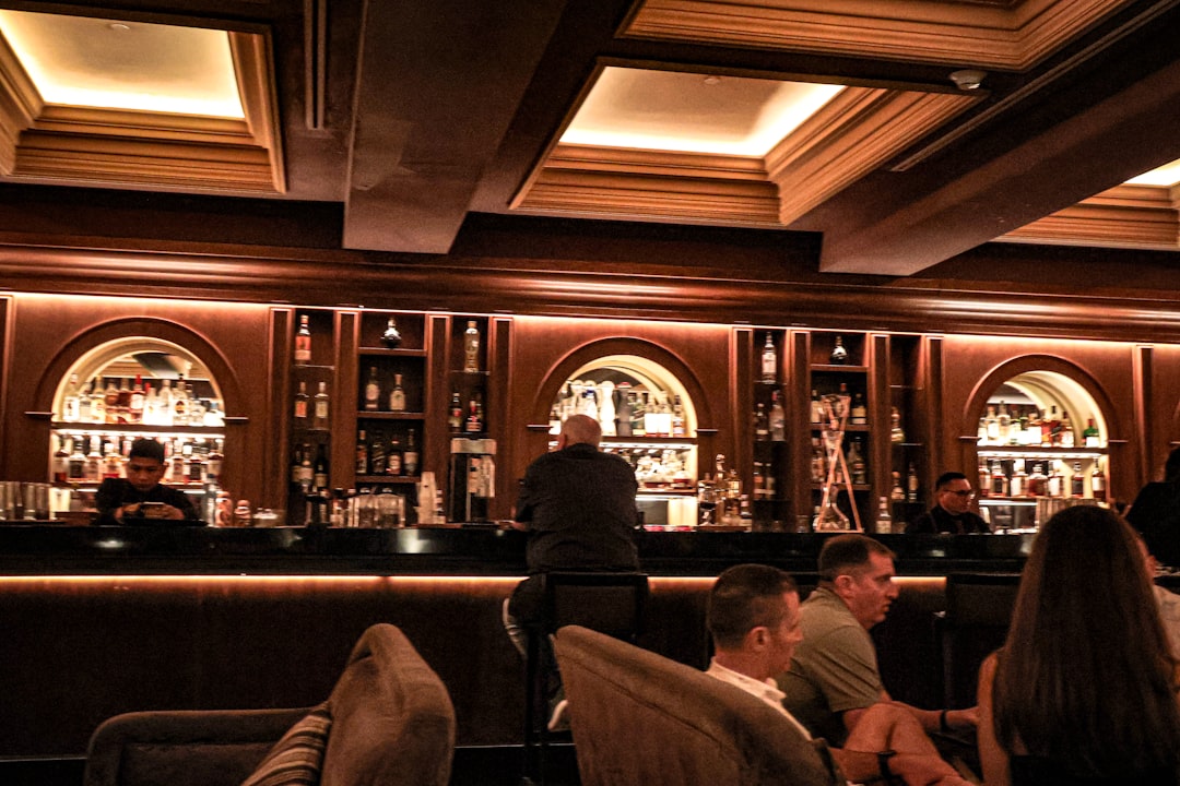 A group of people sitting at a bar
