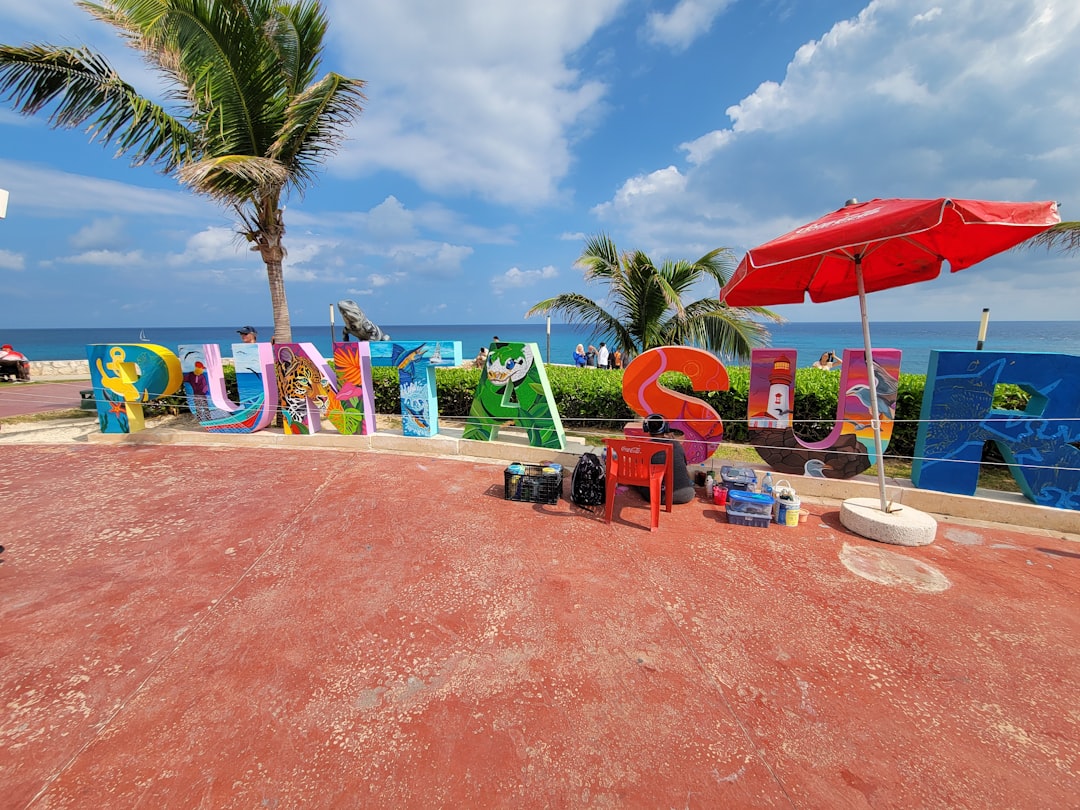 A beach with a lot of colorful signs on it