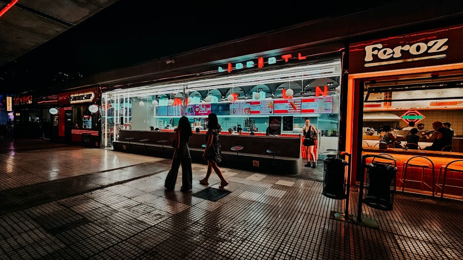 A vibrant nighttime scene at a food stall on the bustling streets of Buenos Aires.