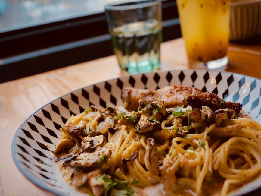 A close-up of flavorful spaghetti with chicken and mushrooms, ideal for food photography enthusiasts.