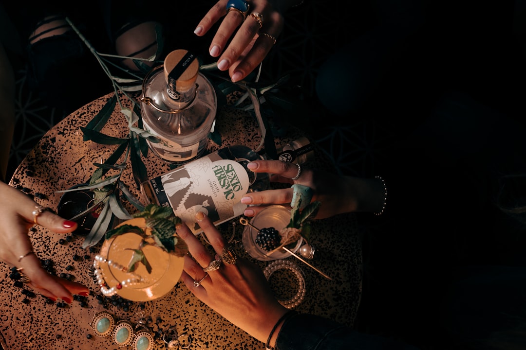 a group of people sitting around a table with drinks