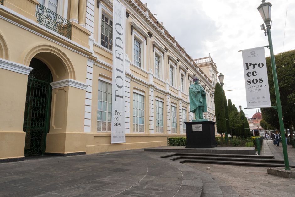 Elegant historic building with statue in Toluca de Lerdo, Mexico, showcasing cultural architecture.
