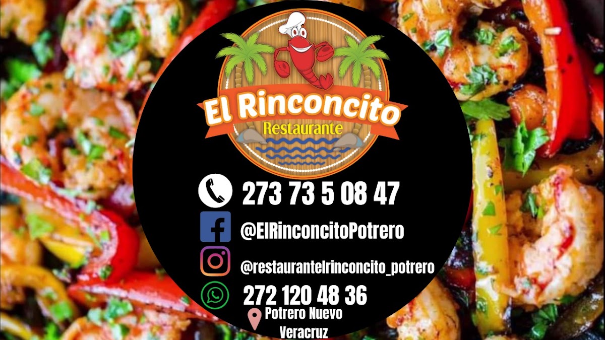 El Rinconcito's dining area with a bowl of mojo sauce and a platter of prawns on the table — close-up