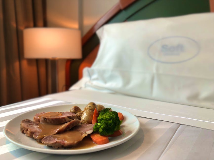 Delicious room service meal featuring roast turkey with vegetables in a hotel setting.