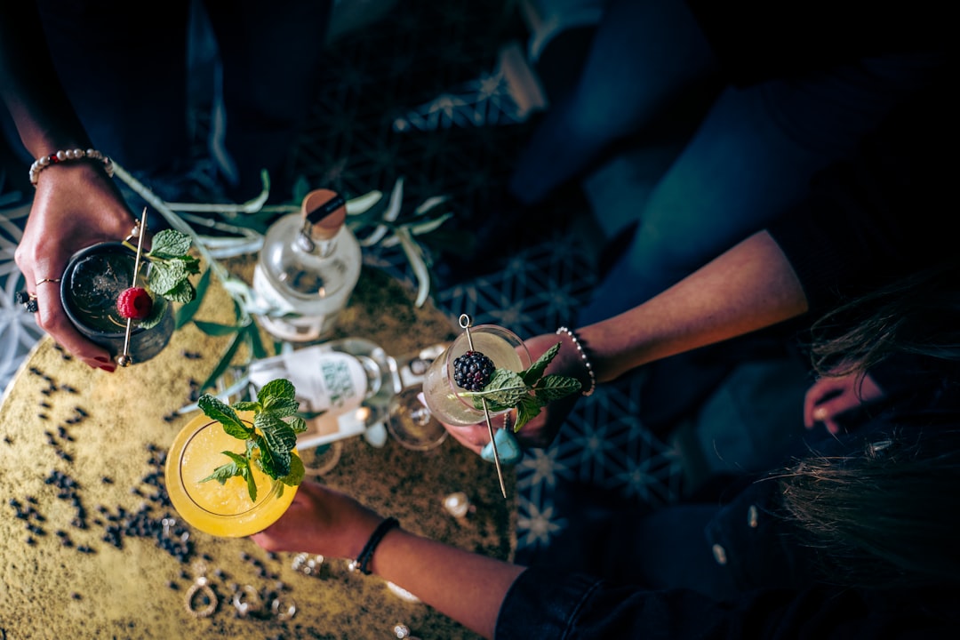 a group of people holding glasses filled with drinks