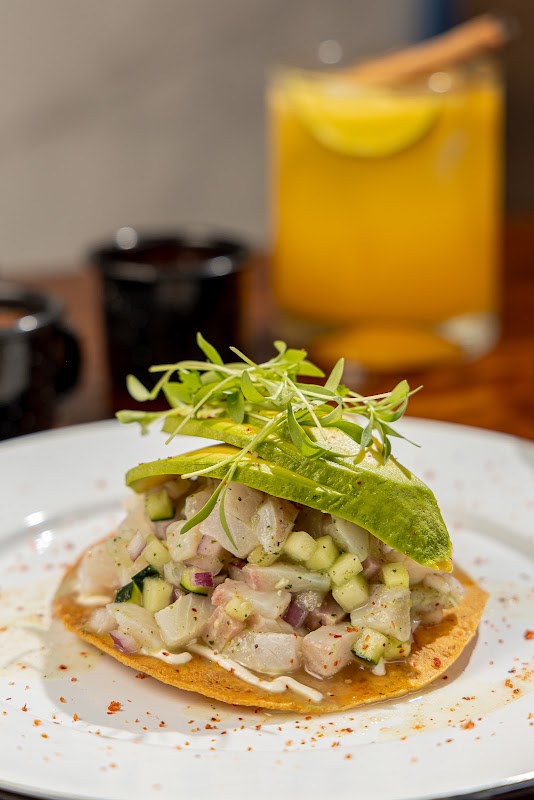 Cabanna Solesta Puebla terrace view with tuna toast and rock shrimp plated on a slate