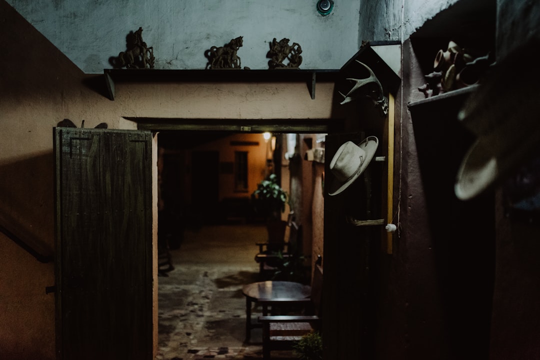 a room with a bunch of hats hanging on the wall