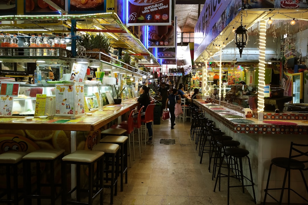 a restaurant filled with lots of tables and chairs
