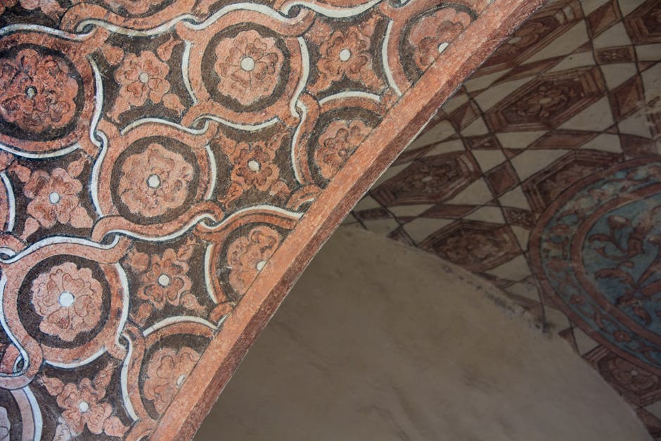 Geometric and floral designs on a historical arch in Malinalco, Mexico.