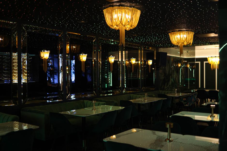 Elegant and glamorous bar interior with chic lighting and sophisticated design elements.