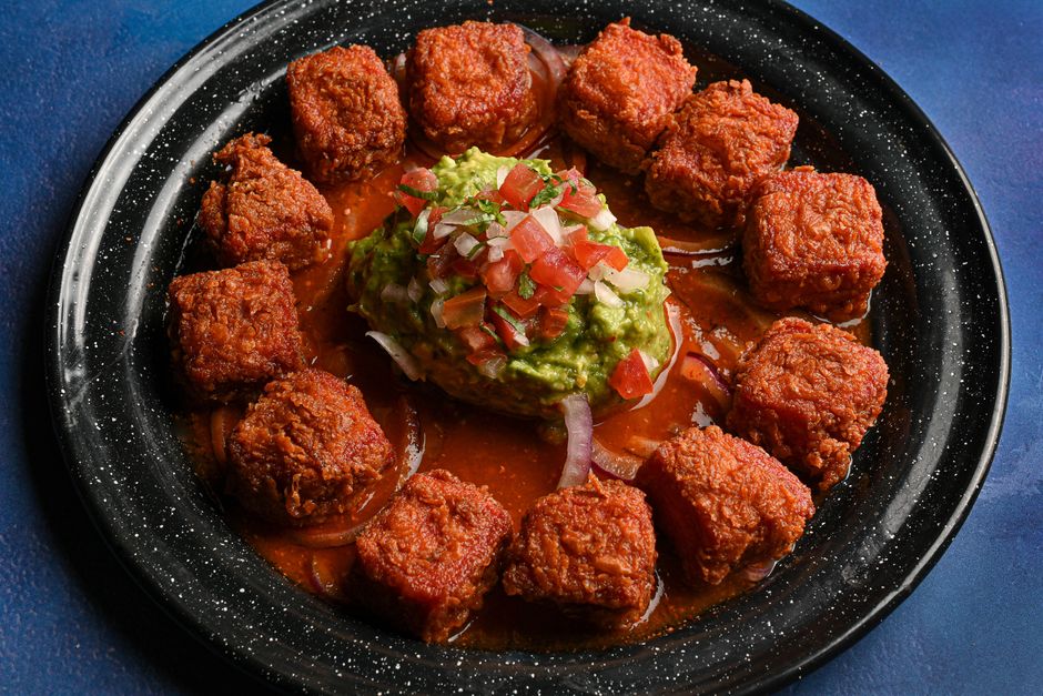 Top view of crispy tacos with guacamole and salsa. Perfect for Mexican cuisine lovers.